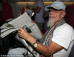 gary-glitter-reading-paper-on-aircraft5