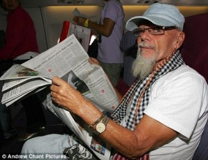 GaryGlitterreadingpaperonaircraft-3