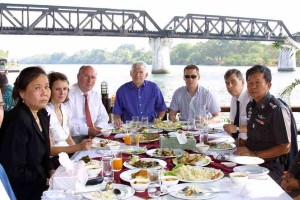 The Arscott and Lloyd families visit Thailand to Meet with Thai Officials and Pay Respect to their children, Vanessa Arscott and Adam Lloyd, who were gunned down by a Thai policeman in Kanchanaburi, Thailand. Lunch at the Bridge Over The River Kwai with the Head of Kanchanaburi Police. Left to right: British embassy translator, Alyssa Arscott, Graham Arscott, Brian Lloyd, Chris Loyd, Peter Kamry (Vice consul Brit Embassy) Pol. Maj General Chaichan Kitichan