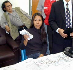 Mayured Kasemjit known as 'Mem' shows Thai police the money that she admitted cheating her former partner Andy Gill out of. Gill was a suspect in the murder of backpacker Kirsty Jones but was released through lack of evidence. Mem told Gill she would use the money to bribe him out of jail, but instead kept it herself.