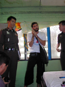 Nathan Foley, 26, with police at the Aree Guest House, Chiang Mai, where former Liverpool University student Kirsty Jones was found murdered on August 10 2000, Foley was arrested on suspicion of murder