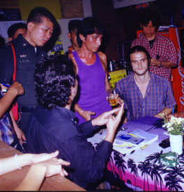 Stephen Trigg(right) being interviewed by police with manager of 'Aree' Guest house in Chiang Mai, where Kirsty Jones was found murdered