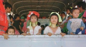 Padaung long-necked hill tribe girls on a truck after being released from a Thai tourist attraction where they were held in captivity.