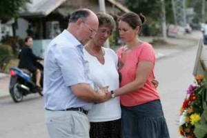 Graham, Joyce and Alyssa Arscott mourn at the site of the murder of Vannessa Arscott, in Kanchanaburi, Thailand. This is the first and only time Joyce will visit the site.